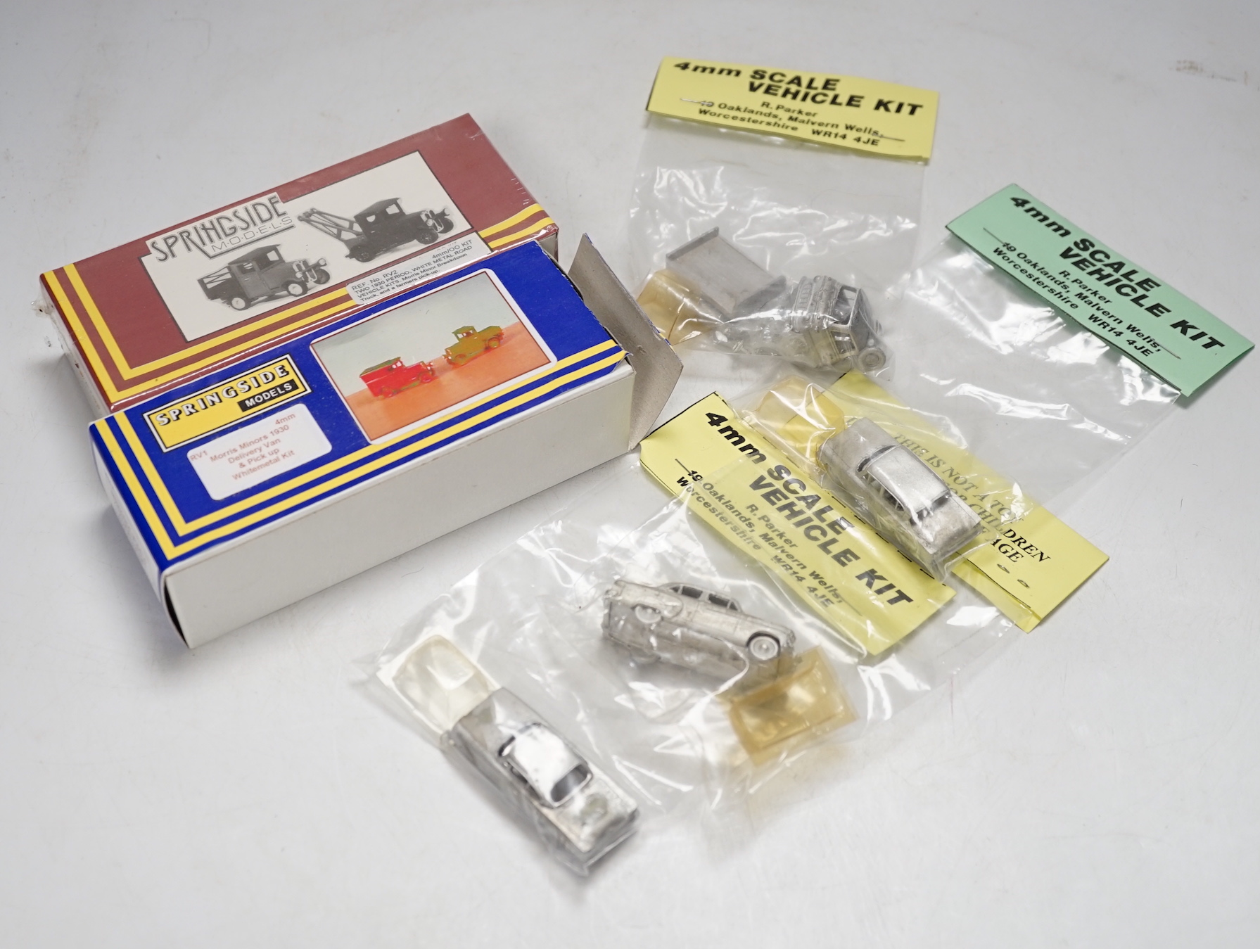 Forty 4mm, OO Gauge model railway unconstructed and packeted white metal kits, by Springside Models and R. Parker, including cars, commercial, vehicles, and motorcycles, together with two ratio kits for LMS clerestory co